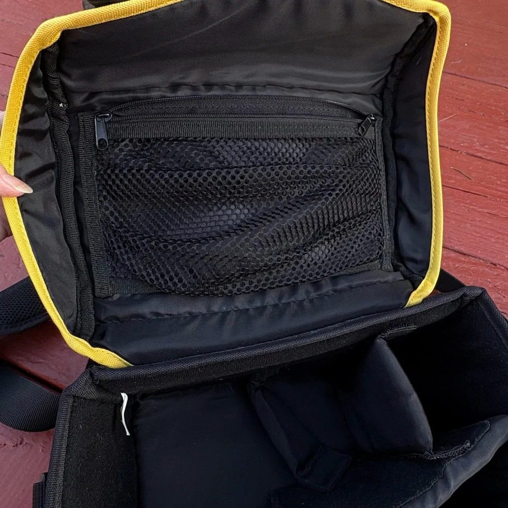 Nikon black camera and accessory shoulder carrying bag
